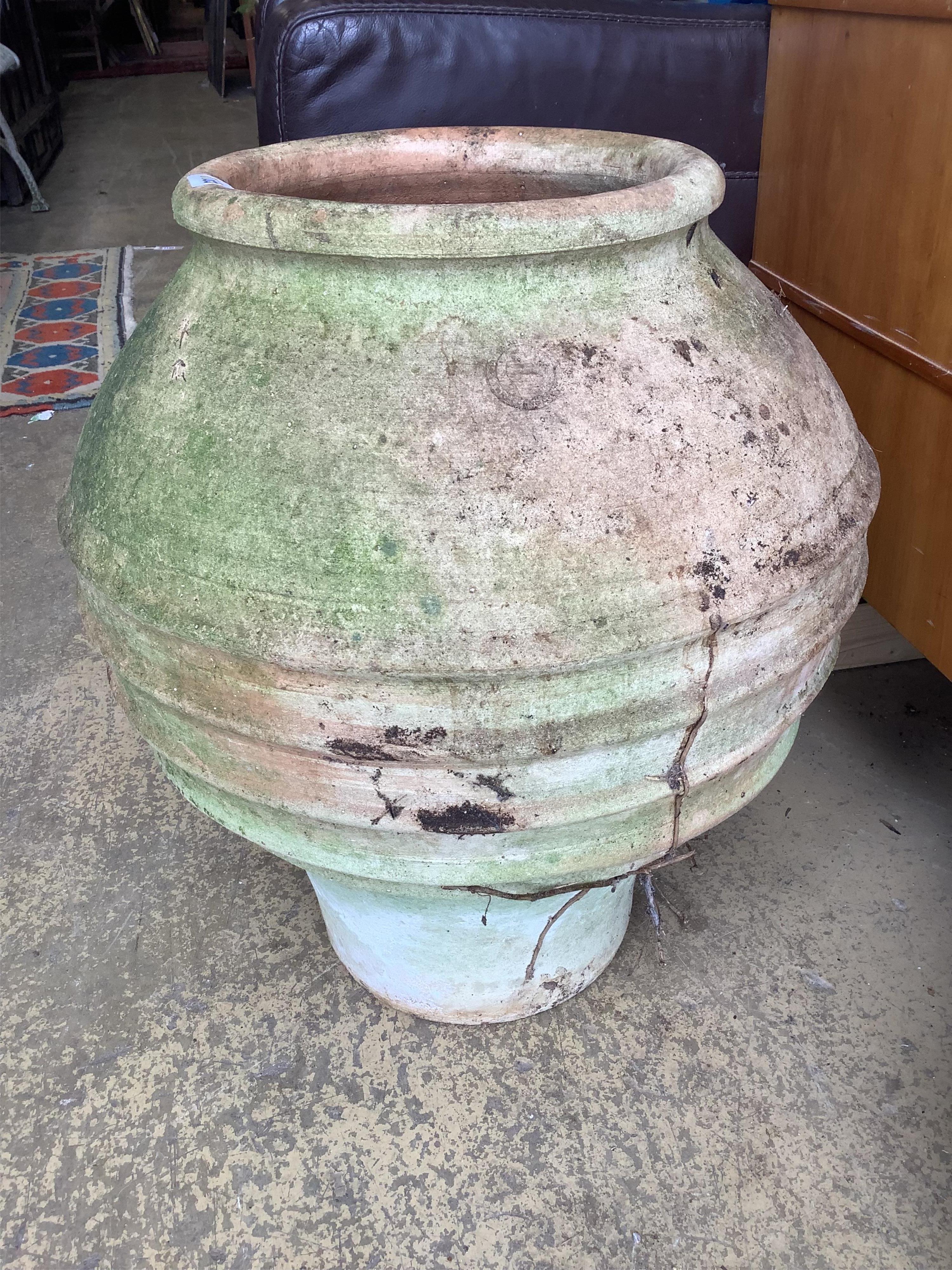 A circular Greek style earthenware garden planter, height 52cm